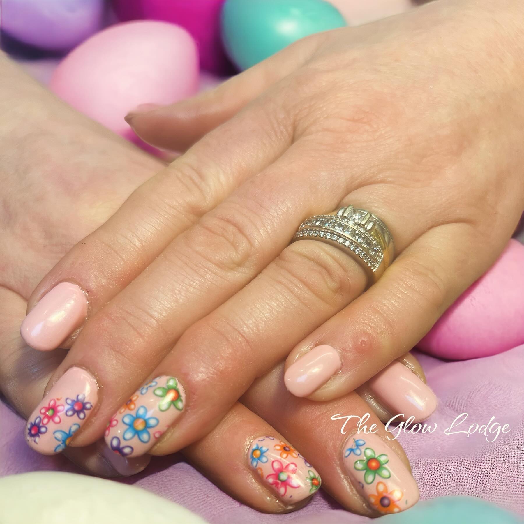 Soft pink nails with hand-painted flowers