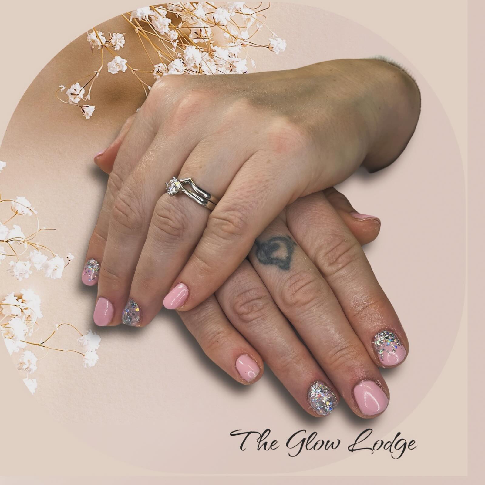 Pale pink nails with glitter accent nails
